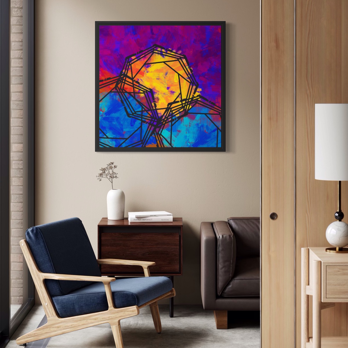 Colorful framed Colorbrew artwork above a blue lounge chair in a modern living room